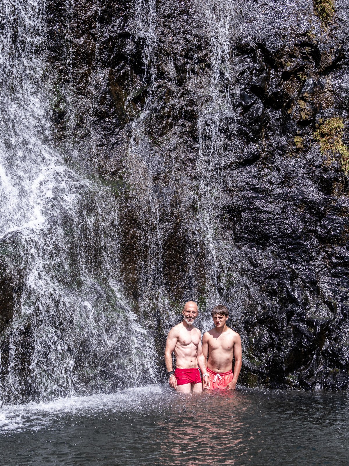 Swimming beneath a cascade during the 2 September hike.